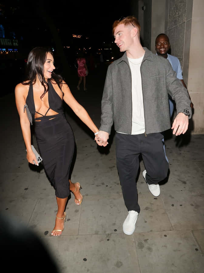 Couple Holding Hands Night Out Wallpaper