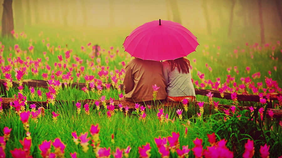 Couple Under Pink Umbrellain Flower Field Wallpaper