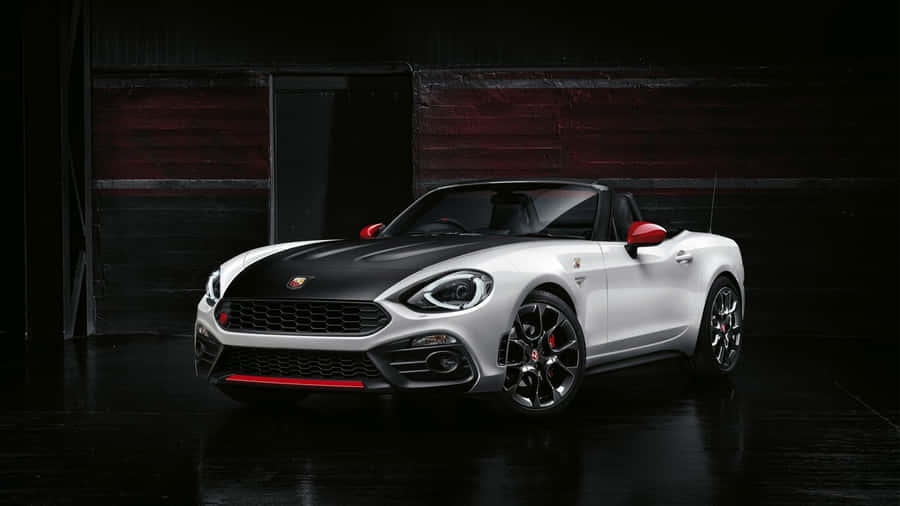 Cruising In Style: The Fiat 124 Spider Convertible Wallpaper