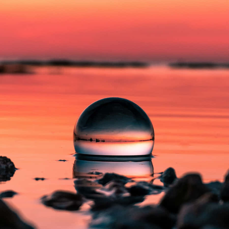 Crystal Ball On Wooden Table With Mystical Light Wallpaper