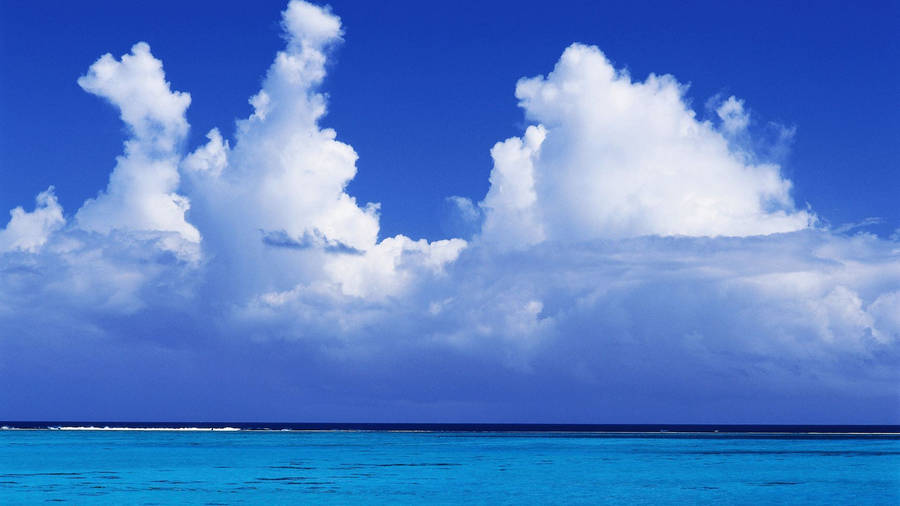 Cumulous Clouds Above Horizon Wallpaper