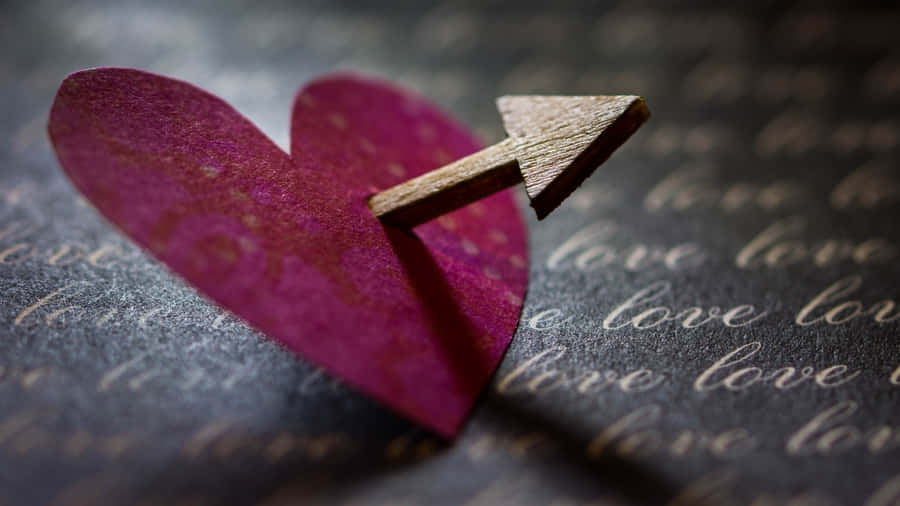 Cupid Arrow Piercing Heart Wallpaper