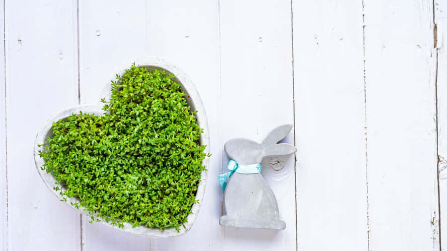 Cute Easter Bunny Peeking Out From Behind A Hay Stack Wallpaper