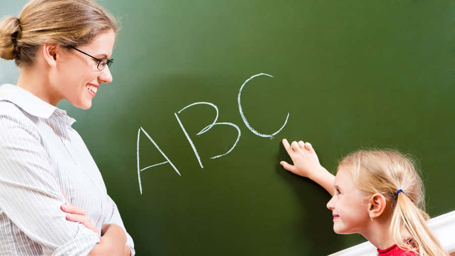 Cute Teacher With Kid Wallpaper