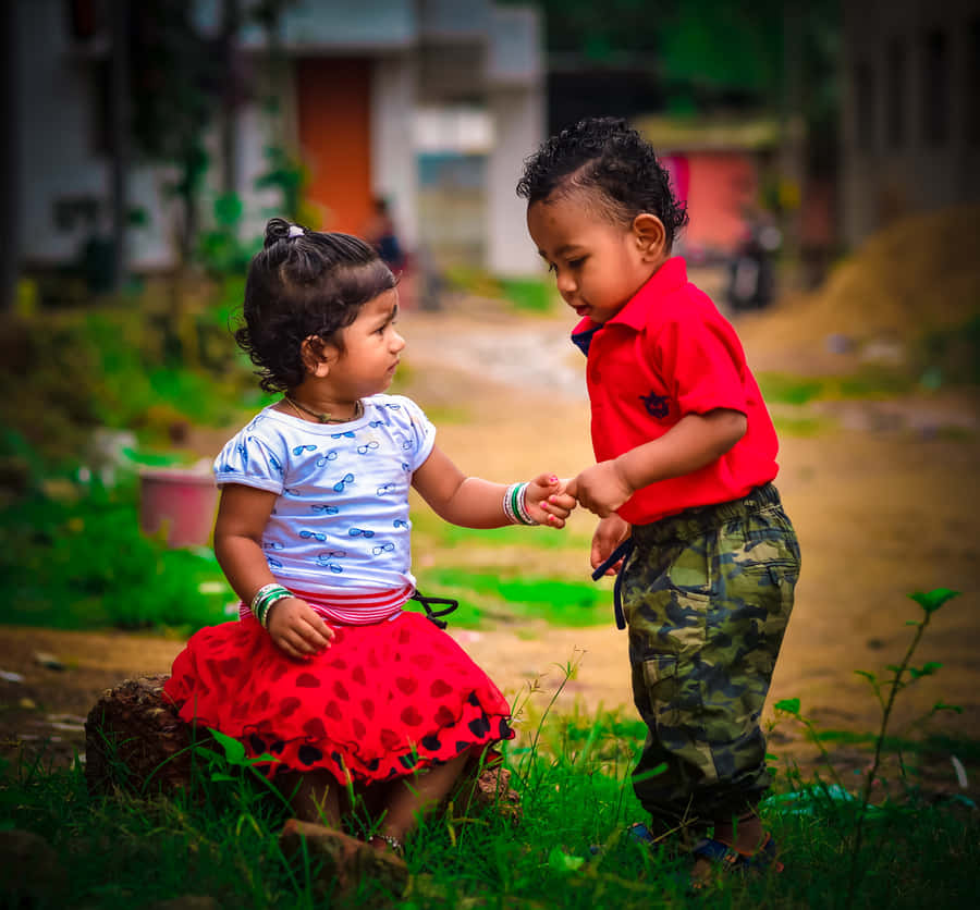 Cute Toddler Smiling In Nature Wallpaper