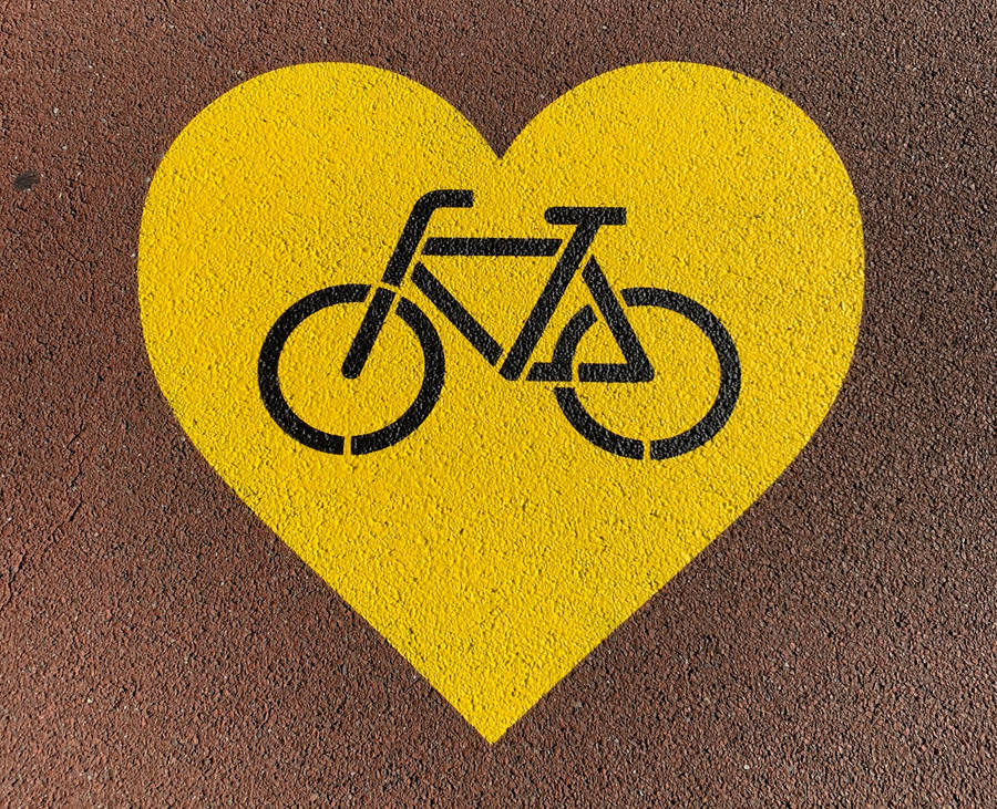Cycling Yellow Heart Sign Wallpaper