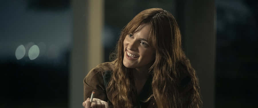 Daisy Jones Smiling Scene Wallpaper