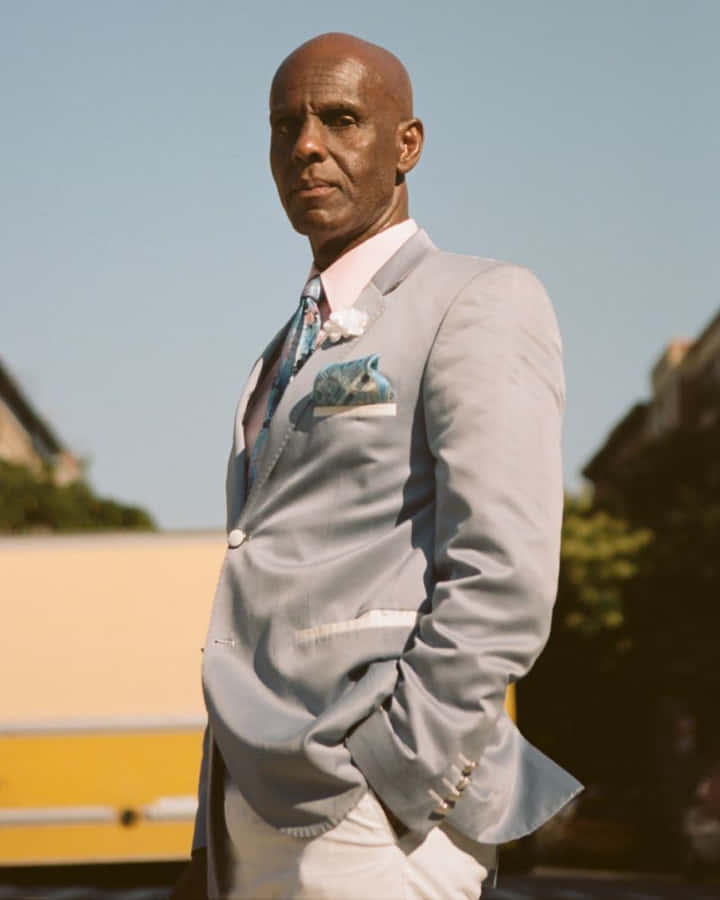 Dapper Dan In A Gray Suit Wallpaper