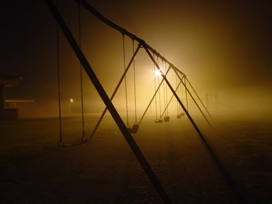 Dark Playground Swing Set Wallpaper