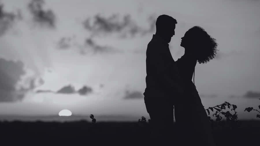 Dark Romance Sunset Embrace Wallpaper