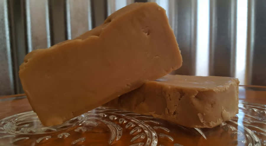 Delicious Homemade Penuche Fudge On A Rustic Wooden Board Wallpaper