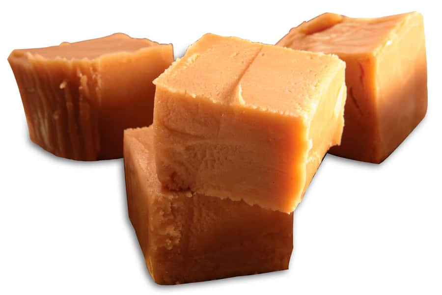 Delicious Penuche Fudge On A Rustic Wooden Table Wallpaper