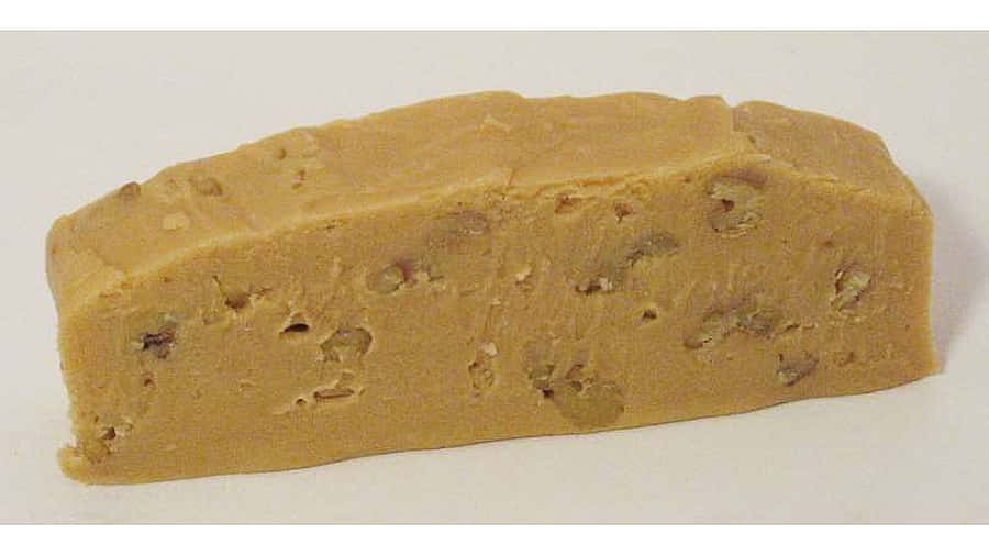 Delicious Penuche Fudge On A Wooden Table Wallpaper