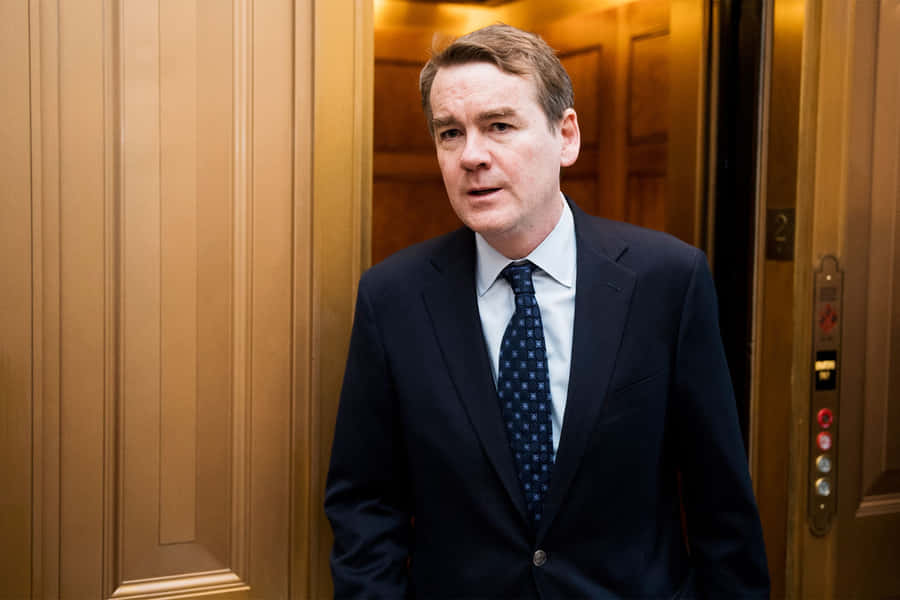 Democratic Presidential Candidate Michael Bennet Leans On Wall Wallpaper
