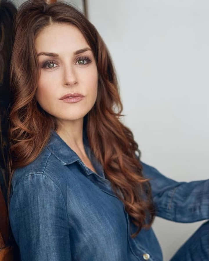 Denim Clad Woman Portrait Wallpaper