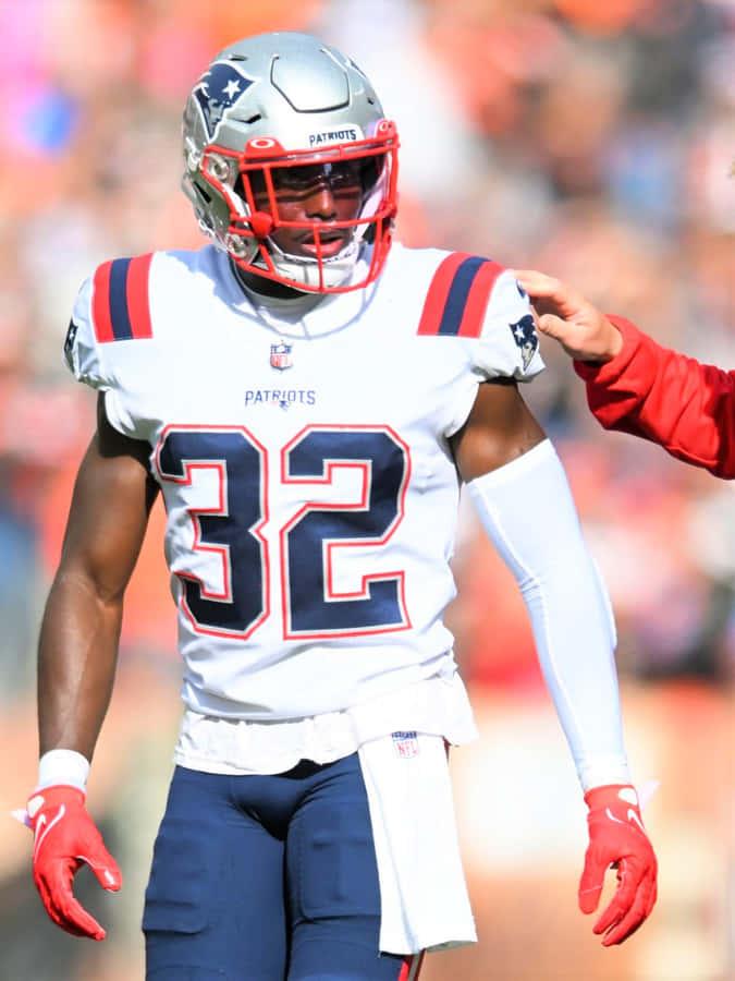 Devin Mccourty In Action On The Field Wallpaper