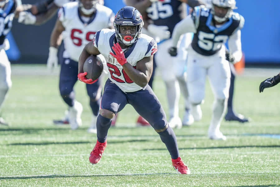 Devin Singletary In Action During Game Wallpaper