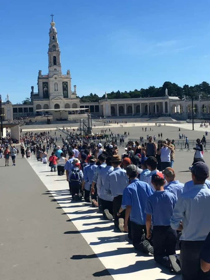 Devotees Praying At Fatima Sanctuary Wallpaper