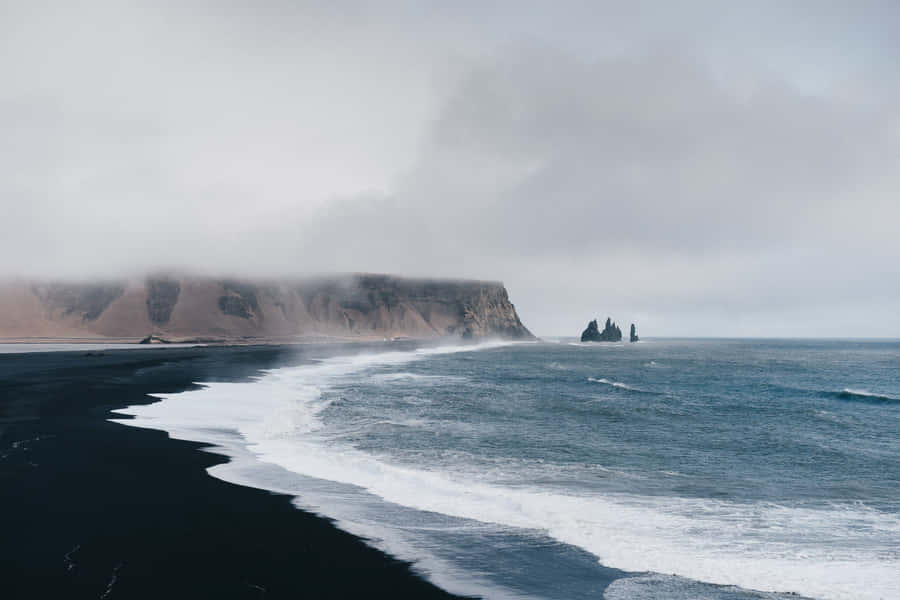 Discover The Uniqueness Of Black Sand Beaches Wallpaper