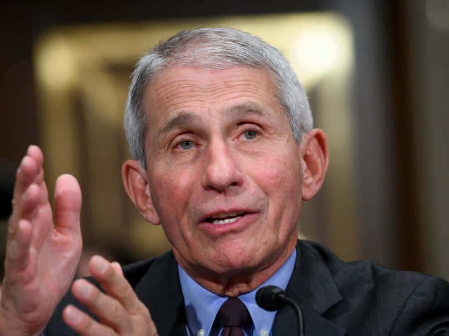 Dr. Anthony Fauci Delivering A Public Health Announcement Wallpaper