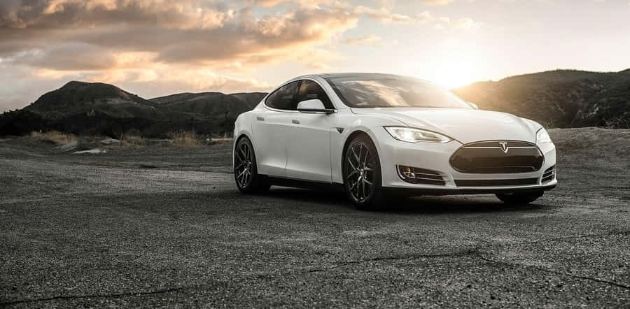 Driving The Future: Sleek Hybrid Car On A Scenic Road Wallpaper