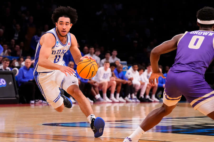Duke Player Dribbling Basketball Game Wallpaper
