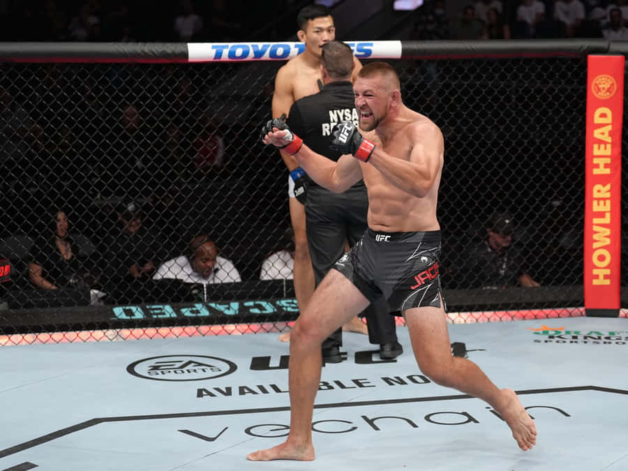 Dustin Jacoby Cheering Fist Pump Wallpaper