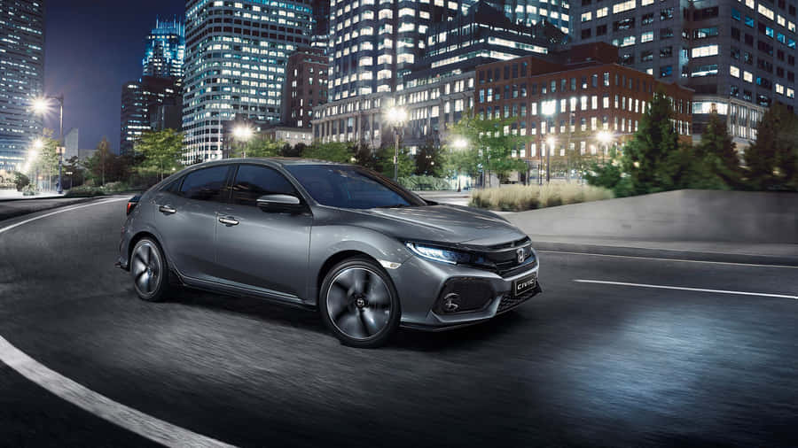 Dynamic Hatchback On The Road Wallpaper