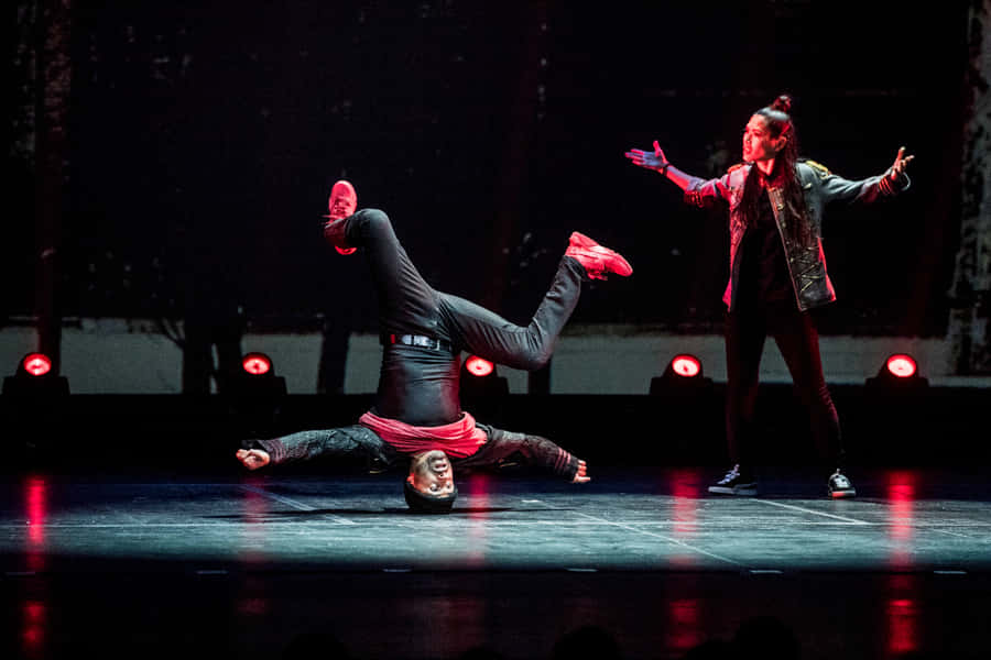 Dynamic Hip Hop Dance Performance Wallpaper