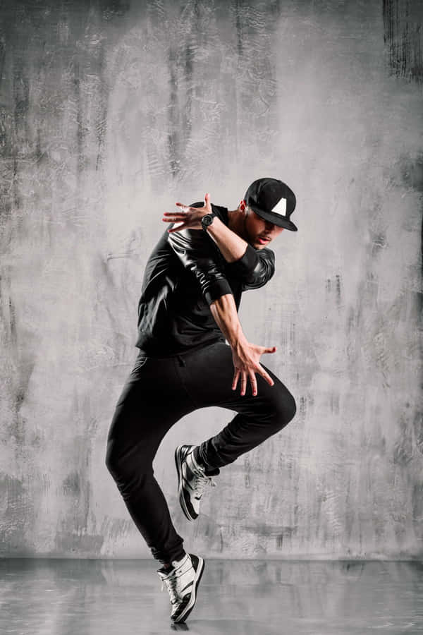 Dynamic Hip Hop Dancerin Action.jpg Wallpaper