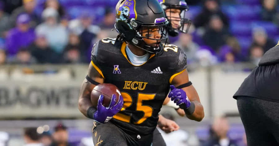 E C U Football Player Running With Ball Wallpaper