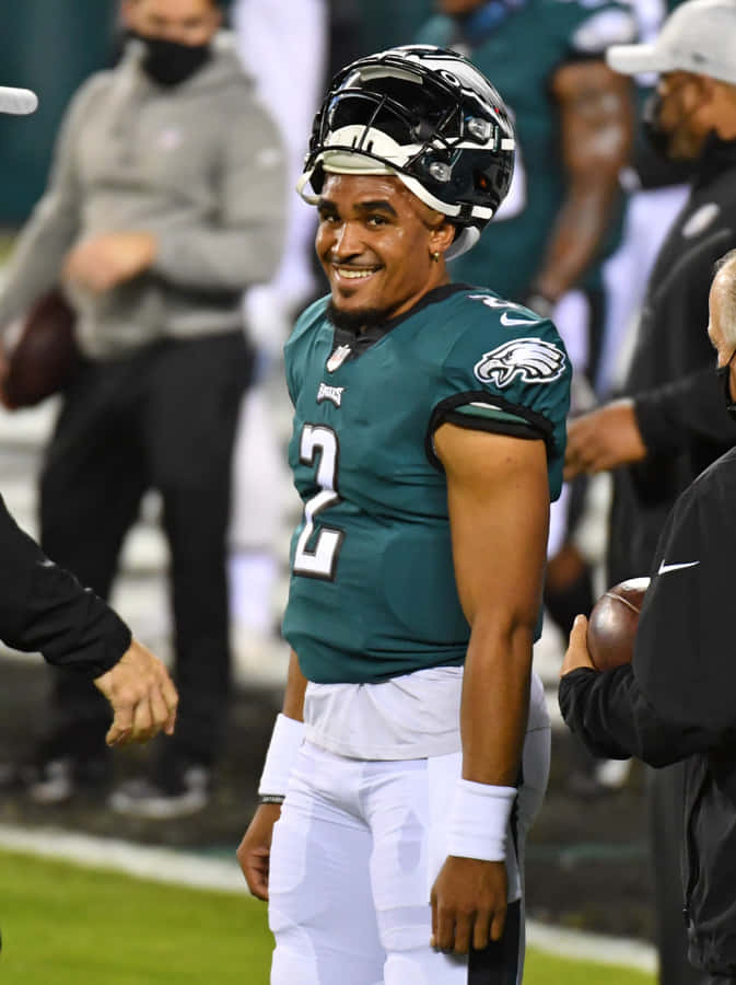 Eagles Quarterback Smiling On Field Wallpaper