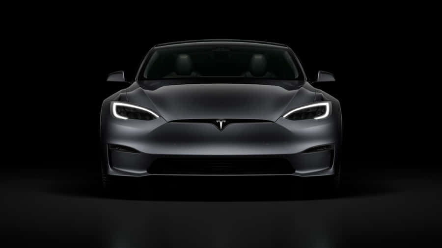 Eco-friendly Hybrid Car On The Road Wallpaper