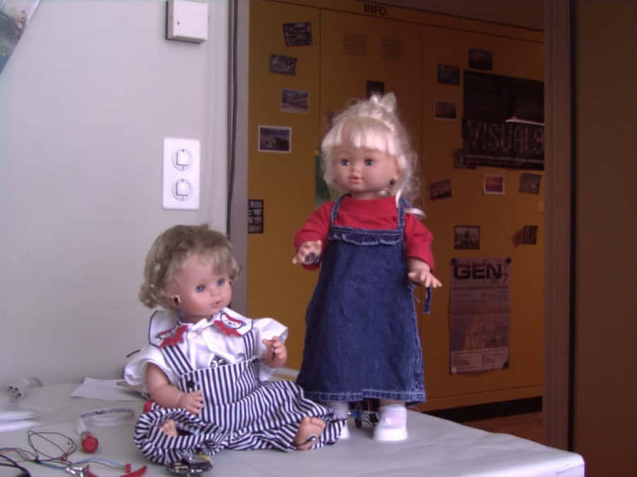 Educational Dollsin Classroom Setting Wallpaper