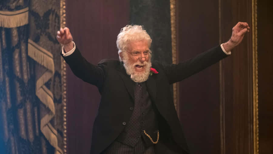 Elderly Actor Celebratory Gesture Wallpaper