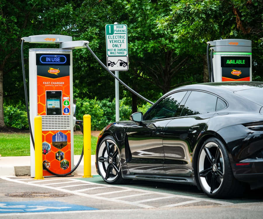 Electric Vehicle On An Open Road Wallpaper