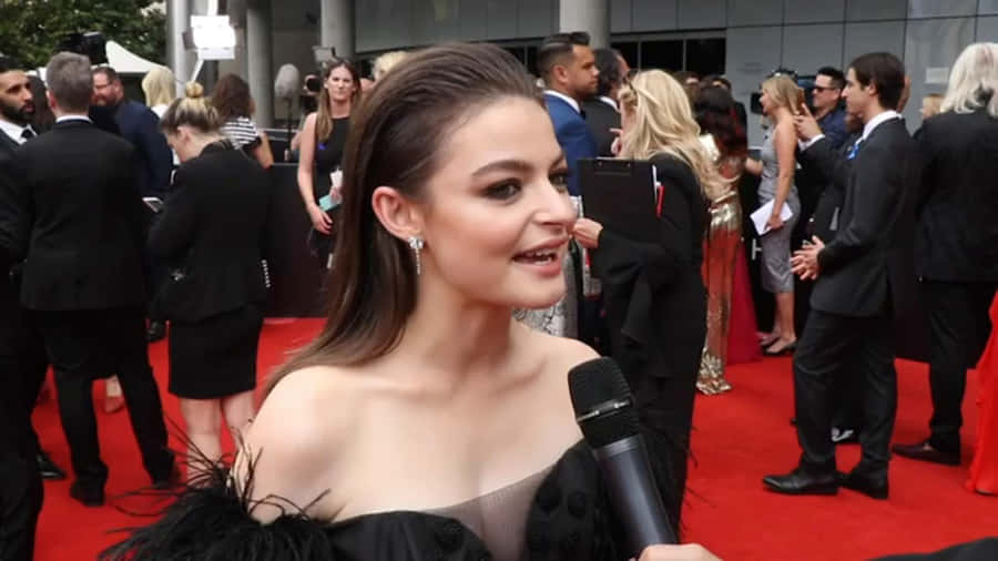 Elegant Celebrity Red Carpet Interview Wallpaper