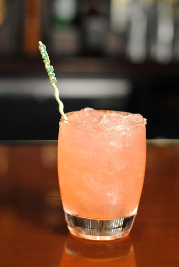 Elegant Cocktail With Citrus Garnish Wallpaper