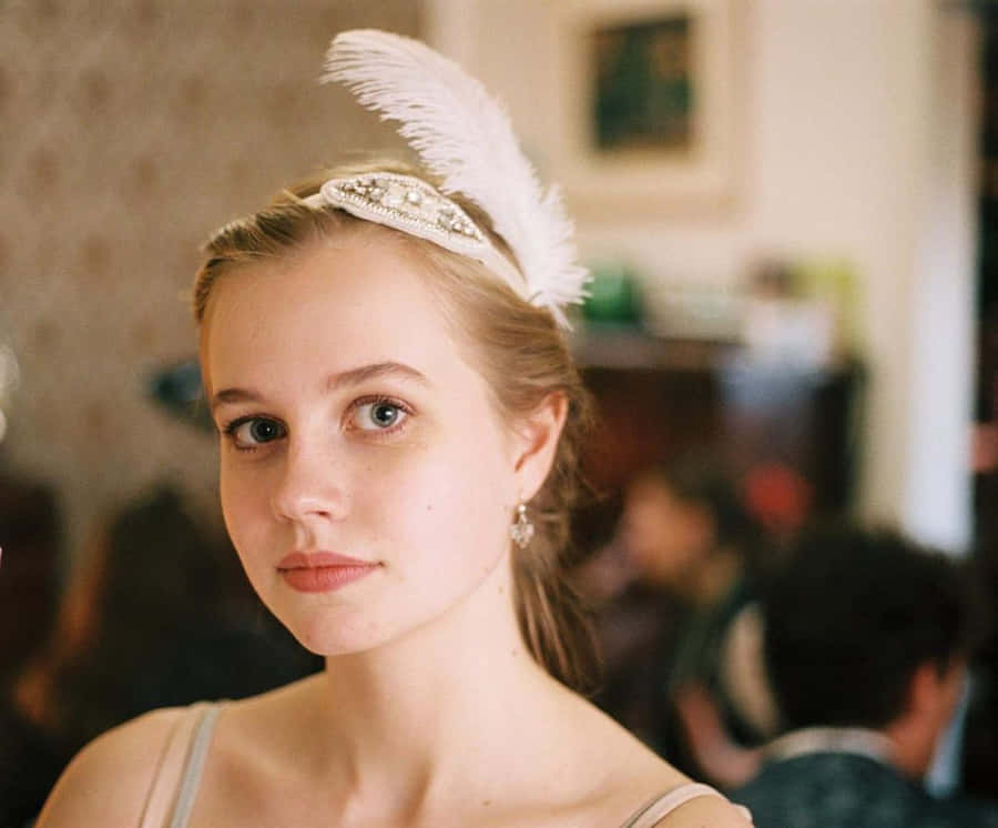 Elegant Feathered Headpiece Portrait Wallpaper