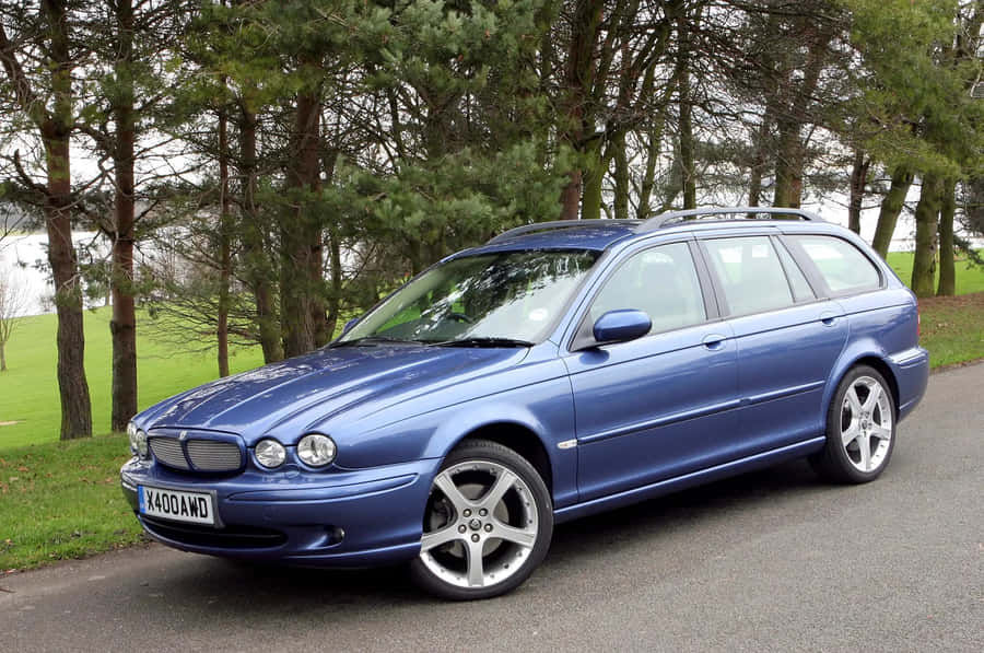 Elegant Jaguar X-type On The Road Wallpaper