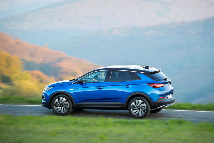 Elegant Opel Grandland X In Nature Wallpaper