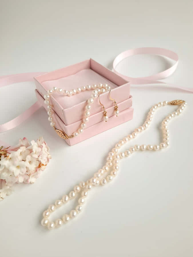 Elegant Pearl Jewelry Setup Wallpaper