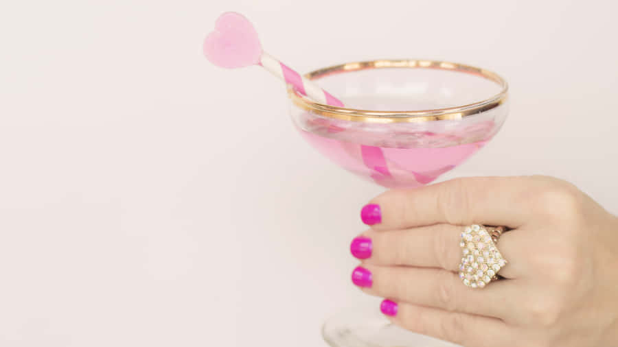 Elegant Pink Champagne In Flutes Wallpaper