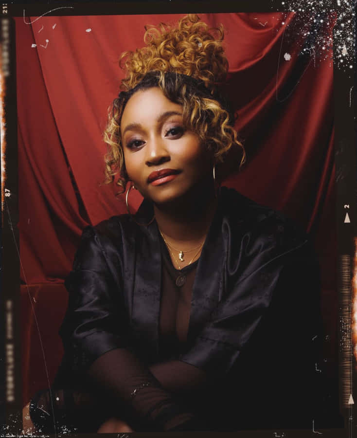 Elegant Portrait Against Red Backdrop Wallpaper