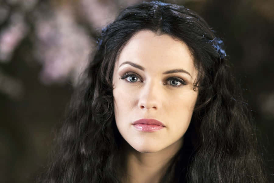 Elegant Portrait Curly Haired Woman Wallpaper