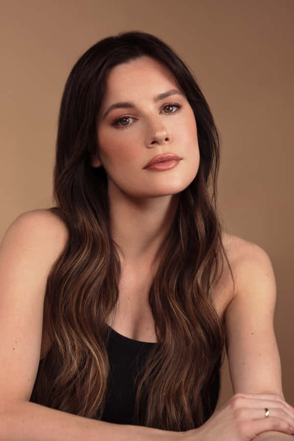 Elegant Portraitof Womanwith Long Hair Wallpaper