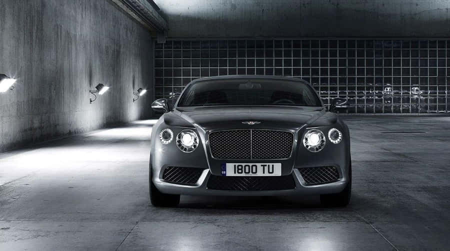 Elegant Red Convertible Riding Into The Sunset Wallpaper