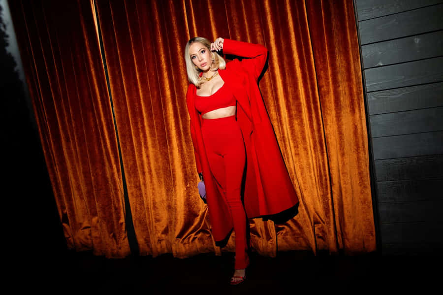 Elegant Red Ensembleat Velvet Curtain Backdrop Wallpaper