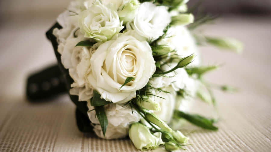 Elegant Wedding Bouquet In Bride's Hands Wallpaper