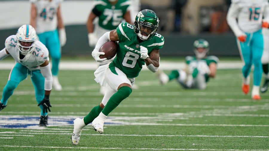 Elijah Moore In Action Against Dolphins Wallpaper